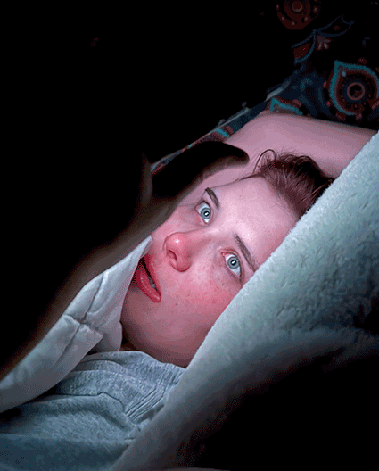 crisp image of a woman invested in her phone